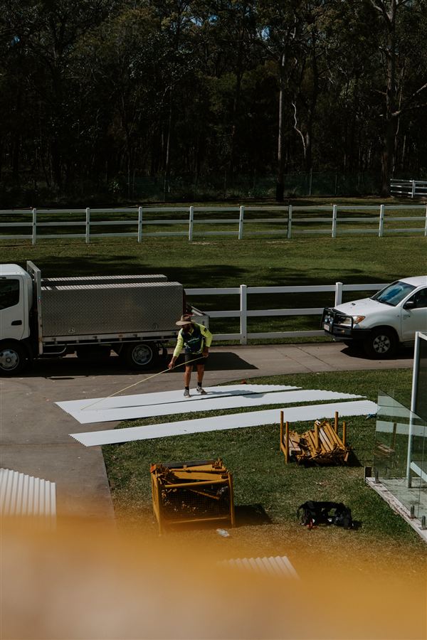 Tradesman working beside his truck on a residential job